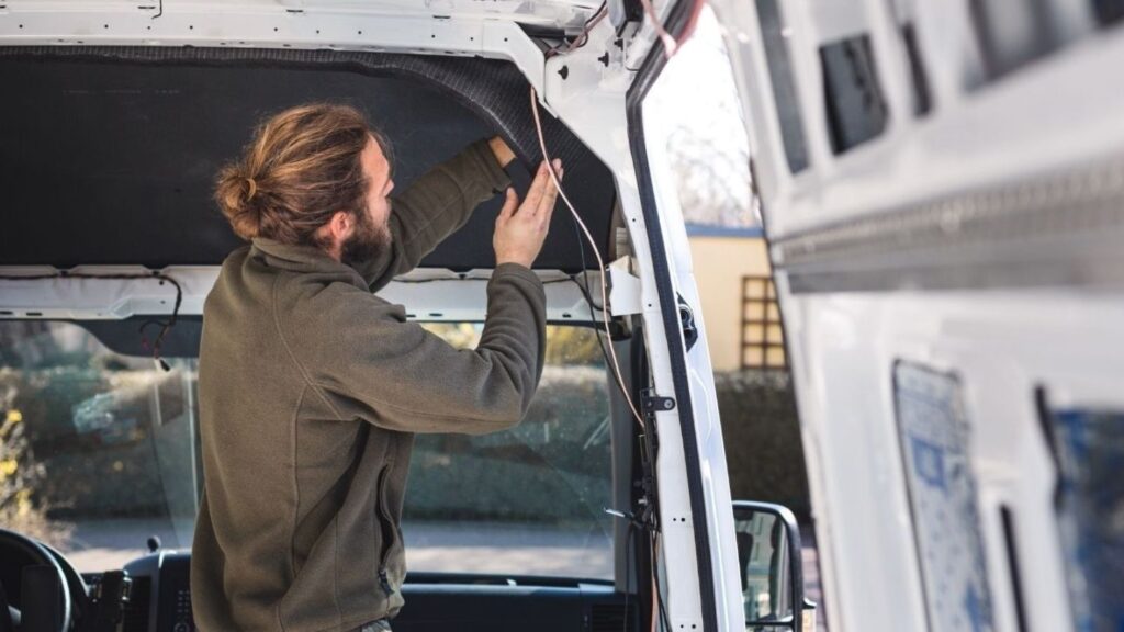 Technician performing RV electrical system repair at customer’s home in Denver